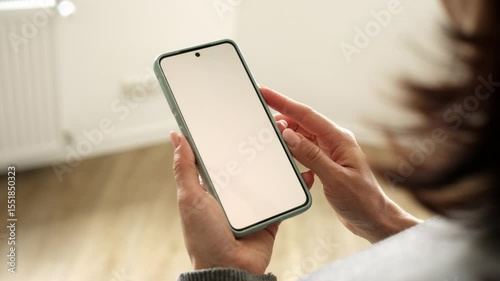 Woman Holding Smartphone With White Screen Blank For Your Text And Design