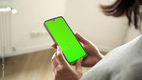 Girl Holding Smartphone With Green Chromakey Screen Blank For Your Text And Design
