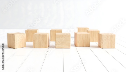 Wooden blocks arranged on white wood.