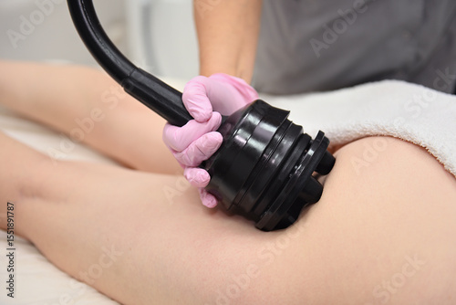 Hardware correction of the figure. Treatment of overweight, body shaping. Anti-cellulite massage at the spa. Vacuum massage of buttocks and legs. Anti-cellulite body shaping procedure