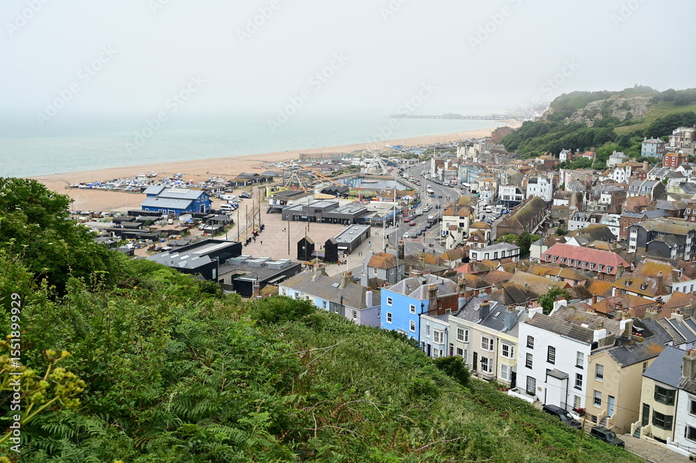 Fototapeta premium Looking down at Hastings, East Sussex on a Misty morning in June