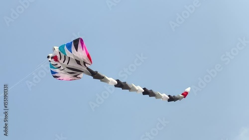 Creative animal-shaped kite dancing in wind
