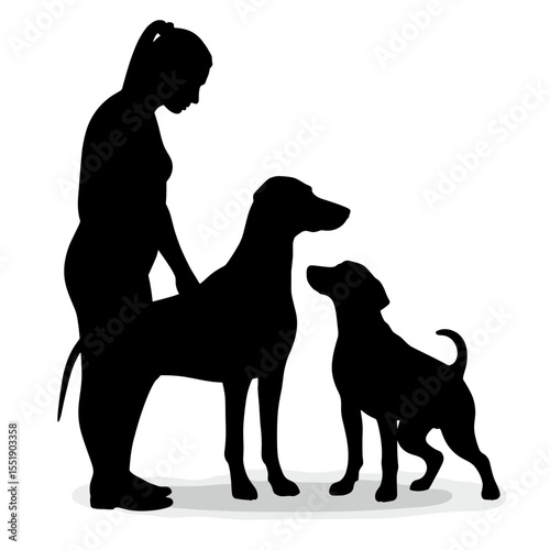 Silhouette of a woman petting two dogs in a playful pose  