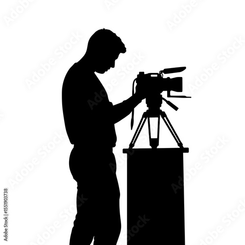 Man silhouette operating a video camera on tripod with backdrop  