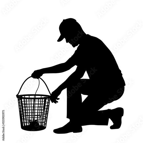 Man kneeling and picking up basket while cleaning outdoors - Concept of silhouette  
