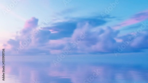 A serene landscape of pastel pink clouds reflected in calm water at sunrise or sunset creating a dreamy atmosphere