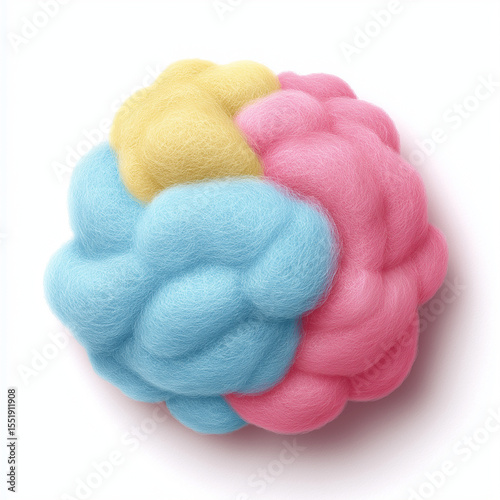 A fluffy ball composed of yellow blue and pink sections on a white background close up studio shot