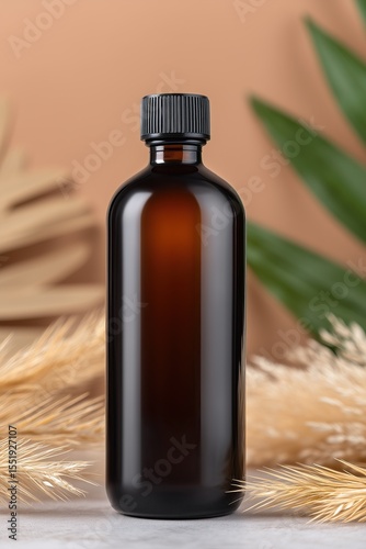 Amber bottle mockup with black cap in soft natural setting with botanical elements