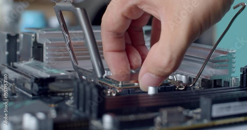 Placing the CPU into the socket aligned with the marked corner.A CPU is aligned and placed into the socket on the motherboard, matching the gold triangle to the marker for correct orientation.