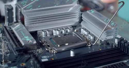 A technician opens the CPU retention lever on a motherboard, carefully preparing to remove the central processing unit from its socket.