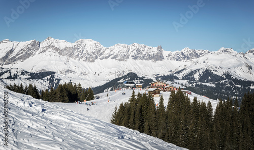 Mountain restaurant and Alpette chairlift station in a snowy landscape, Megeve, Haute-Savoie, France