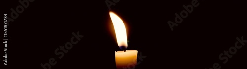 Candle that is lit in the dark