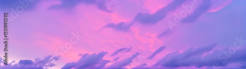Purple and pink clouds in the sky over a beach