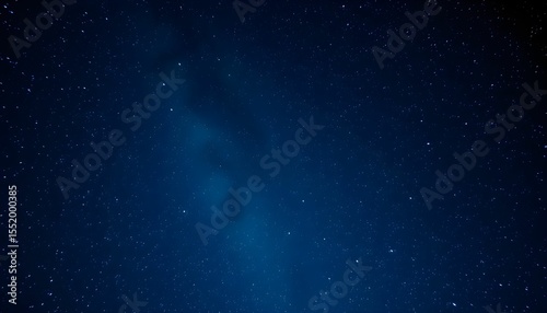 A dark blue night sky filled with countless stars, creating a vast and cosmic scene.