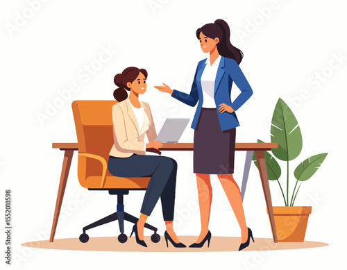 Two Women Discussing Business Seated at Wooden Desk with Laptop and Potted Plant in Light Filled Office Interior