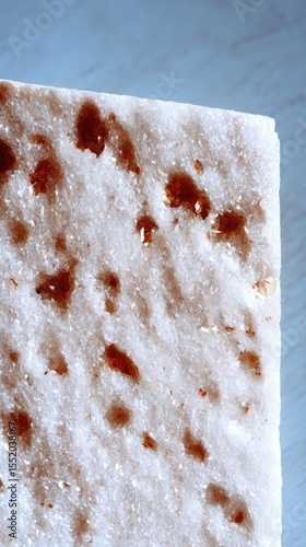 Close-Up of White Mica Stone Surface with Brown Crystal Shimmer