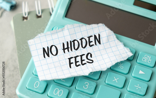 A calculator with a piece of paper on it that says No Hidden Fees