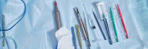 Fotografie Surgical instruments arranged on sterile drape in operating room including elect
