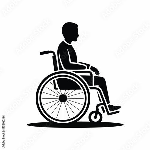 Silhouette of a man sitting in a wheelchair viewed from the side