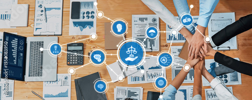 A professional team collaborates during a business ethics meeting, utilizing digital tools and visual data to enhance decision-making and promote transparency in the workplace. Amity