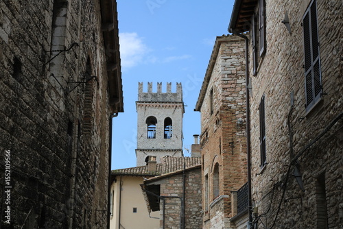 Streets in the old town of San Gimignano with tower in the background. Tuscany, Italy.