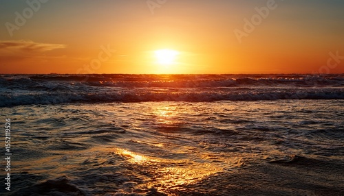 ocean water glowing under a soft golden sunset