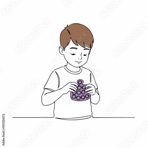 Autistic boy playing with fidget toy and smiling indoors  
