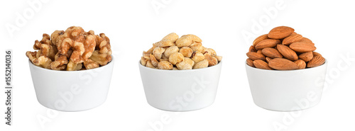 Group of walnuts, peanuts and almond nuts in white bowl isolated cutout on transparent