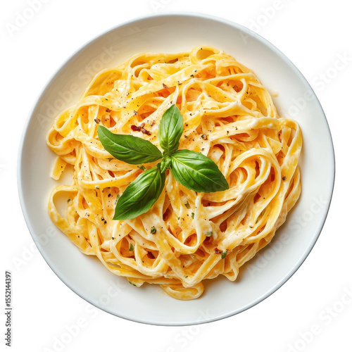 Delicious fettuccine alfredo pasta dish with fresh basil garnish served in a white bowl isolated on transparent background