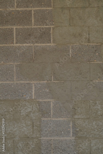 gray brick wall with streaks and green stone tint