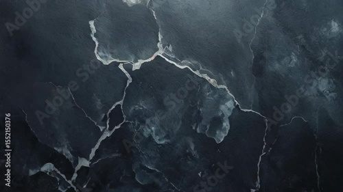 The element of black slate stone texture creates a sophisticated and natural background, with its deep tones and layered surface evoking strength, elegance, and timeless raw beauty in design