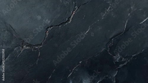 The element of black slate stone texture creates a sophisticated and natural background, with its deep tones and layered surface evoking strength, elegance, and timeless raw beauty in design