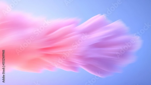 Abstract pink and purple fluffy cloud against a blue backdrop, creating a dreamy visual effect.