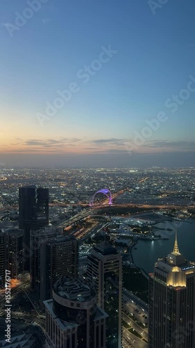 Wallpaper Mural Doha's illuminated skyline at twilight, with the glowing Ferris wheel.
 Torontodigital.ca