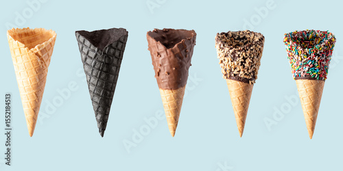 Various ice cream cones isolated on blue background. Banner design.