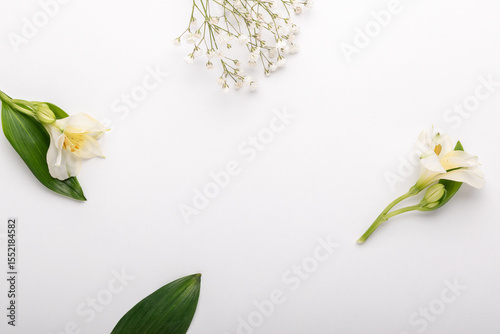 Minimal concept made with flowers on white background.
