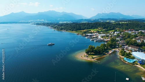 Aerial view of Prien am Chiemsee, a charming Bavarian town on the shore of Lake Chiemsee. Captured in summer, perfect vacation vibes with clear water, green landscapes, and sunny weather