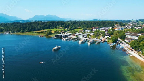 Aerial view of Prien am Chiemsee, a charming Bavarian town on the shore of Lake Chiemsee. Captured in summer, perfect vacation vibes with clear water, green landscapes, and sunny weather