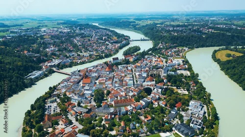 Wasserburg am Inn captured from above, uniquely nestled in a dramatic river bend. This Bavarian town enchants with colorful buildings, medieval charm, and scenic natural surroundings