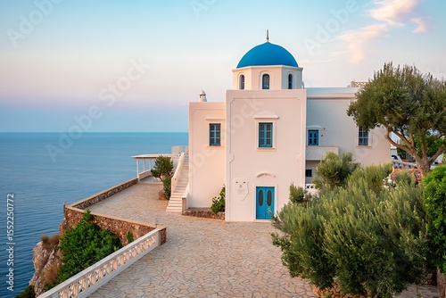 Captivating Greek architecture featuring whitewashed buildings and blue domes overlooking the sea