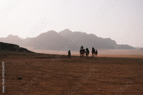 Horse riders in the desert of Jordan