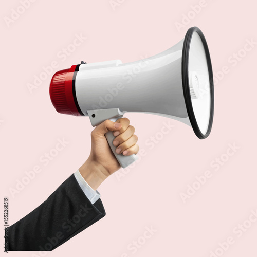 Hand holding a white megaphone against white background for making announcements and broadcasting messages