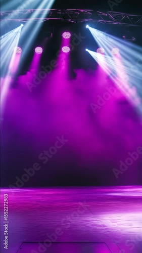 A stage with purple lights and smoke. Scene is mysterious and dramatic