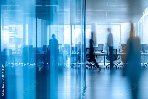 Blurred background of a bright, modern office interior with people working  