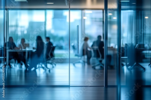 Blurred background of a bright, modern office interior with people working  