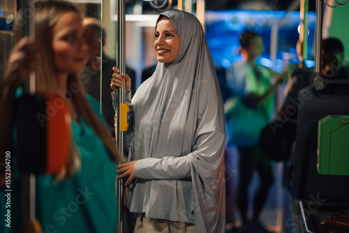 Wallpaper Mural Muslim woman wearing hijab riding public transport bus Torontodigital.ca