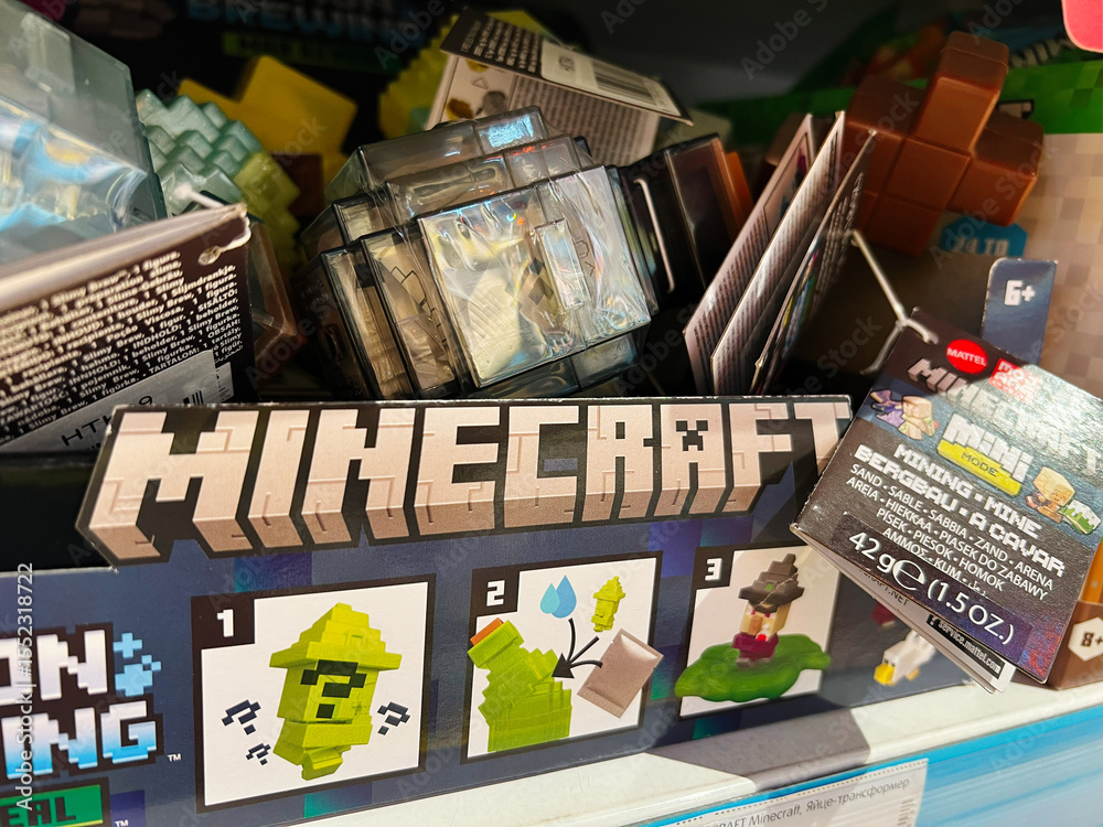 Naklejka premium Minecraft themed merchandise displayed on a store shelf with assorted toy items