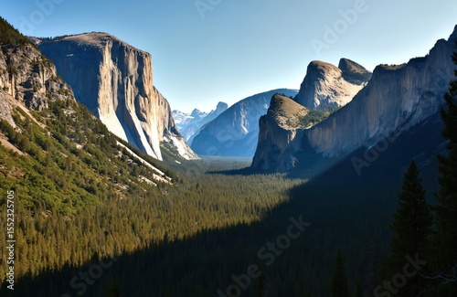 Scenic view of Yosemite Valley, El Capitan, Half Dome in Yosemite National Park. Forest of pine trees, rock formations. Clear blue sky. Famous travel destination.