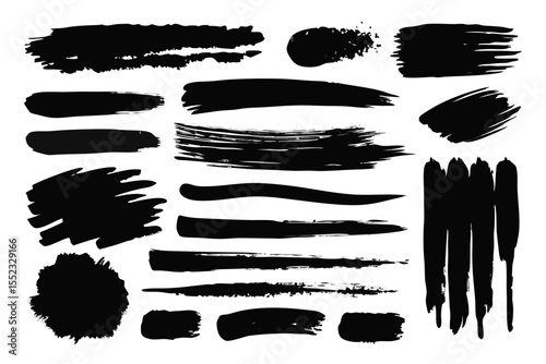 Collection of black brush stroke paint splatters and lines isolated on white background