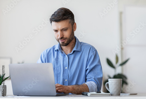 Business Lifestyle. Busy Office Worker Using Laptop At Workplace In Office, Typing On Keyboard, Writing Emails, Free Space